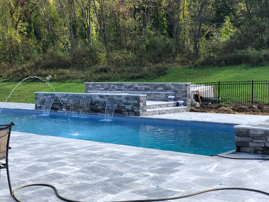 Pool Installation we completed with waterfall. 
